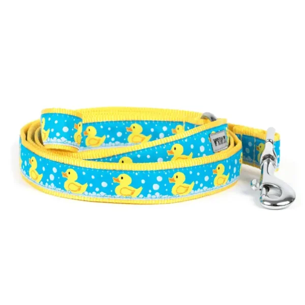 A blue dog leash with a yellow rubber duck pattern and a yellow trim.