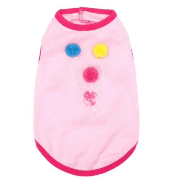 A pink dog tank with colorful pom-poms and a bow design on the front.