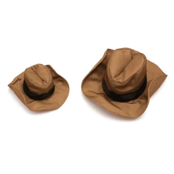 Two brown cowboy dog hats, one larger and one smaller, with a decorative design.