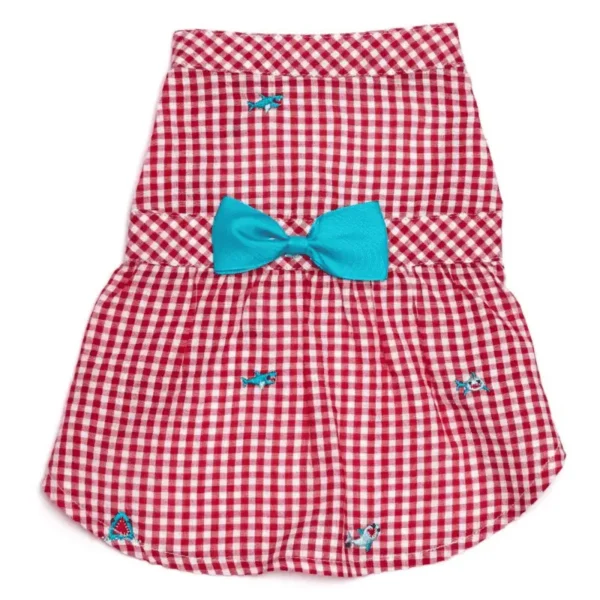A red and white checkered dress with embroidered shark designs featuring a blue bow.