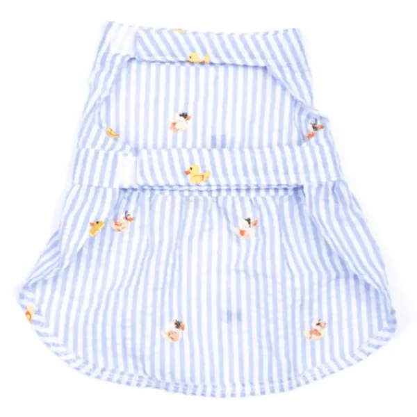 A blue and white striped dog dress with a playful pattern of small ducks.