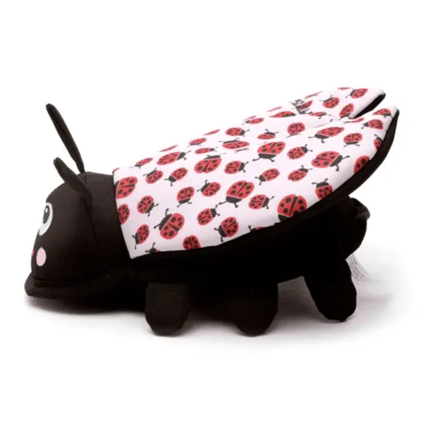 A plush dog toy in the shape of a ladybug, featuring black and pink wings with red ladybug patterns.