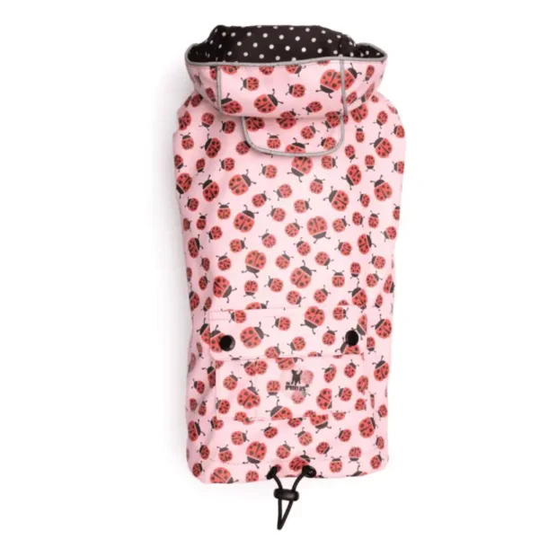 A dog raincoat with a ladybug pattern and a black polka dot lining.