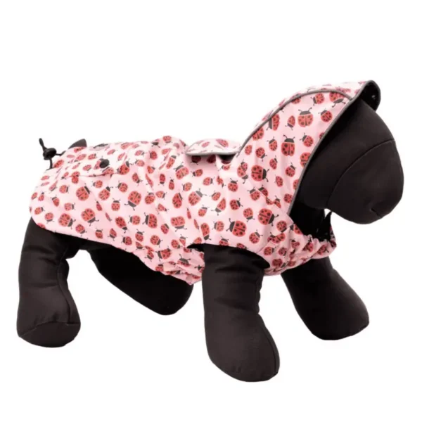 A plush dog mannequin wearing a pink raincoat with a ladybug pattern.