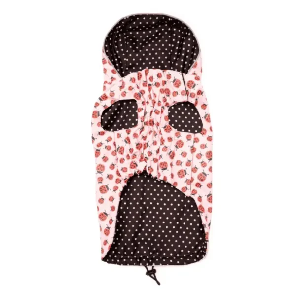 A pink and black dog raincoat with a ladybugs pattern and polka dots.