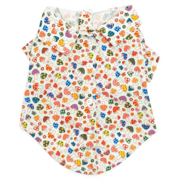 A short-sleeved dog shirt featuring a colorful pattern of small mushrooms, flowers, and hearts on a light background.