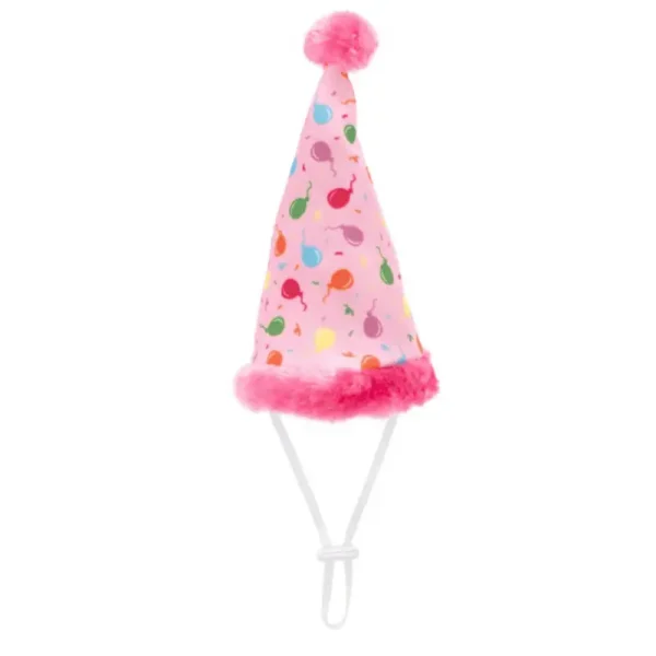 A pink dog birthday hat with colorful designs and a fluffy pink trim and pom-pom on top.