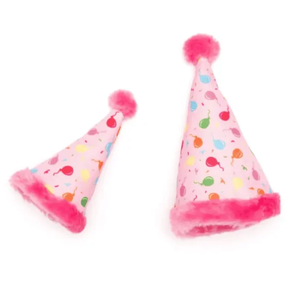 Two pink dog party hats with colorful balloon patterns and pom-pom tops.