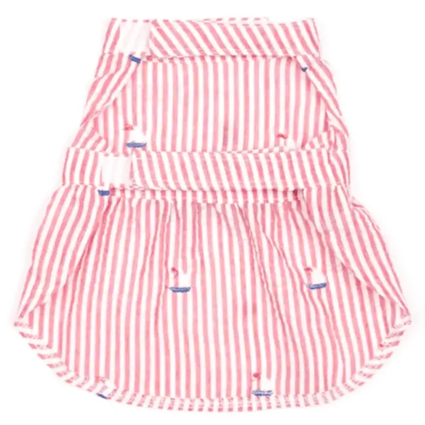 A red and white striped dress with a flared bottom and small sailboat designs and a blue bow.