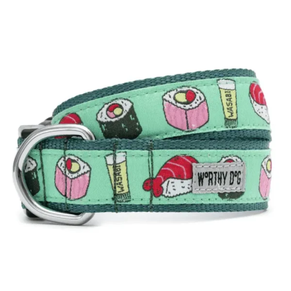 A mint green dog collar featuring colorful sushi and wasabi patterns.