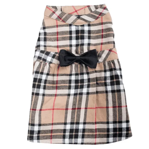A tan plaid dog dress with a black bow at the waist.
