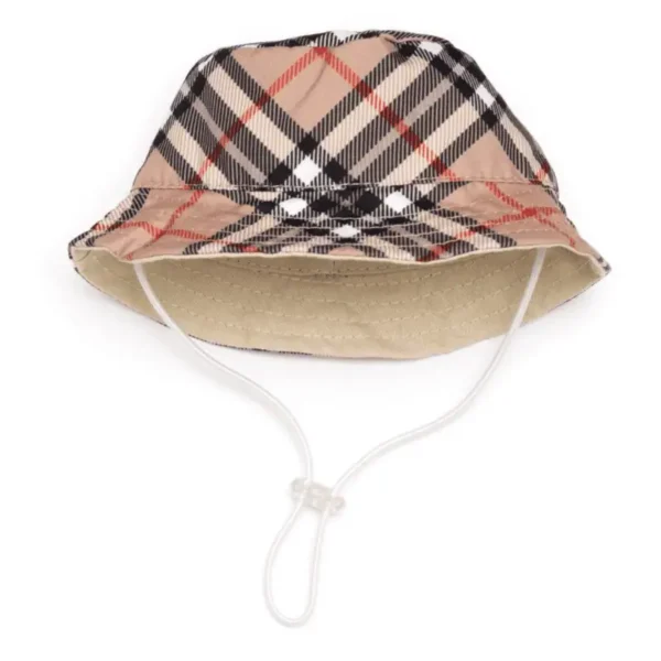 A tan and black plaid dog bucket hat with a chin strap
