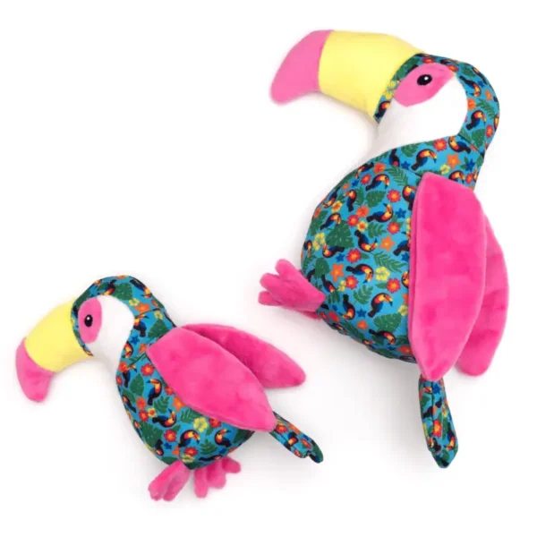 Two colorful plush toucans dog toys, one large and one small, featuring vibrant patterns in shades of blue, pink, and yellow.