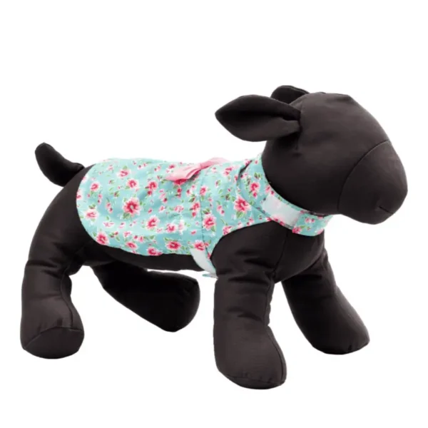 A plush dog mannequin wearing a light blue floral apron.