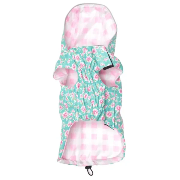 A floral-patterned dog raincoat in shades of teal and pink.