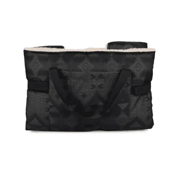 Travel dog bed folded into a black tote bag with a patterned design and faux fur lining.
