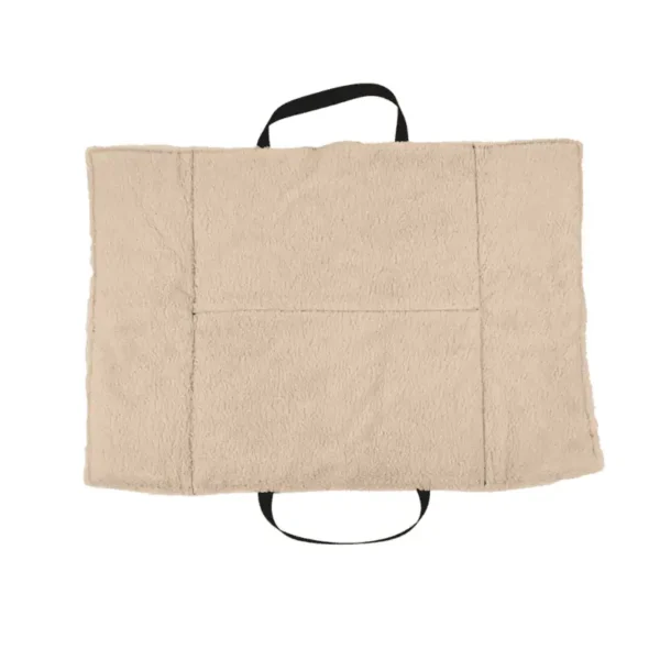 Inside the dog travel bed. A beige pet blanket with black handles.