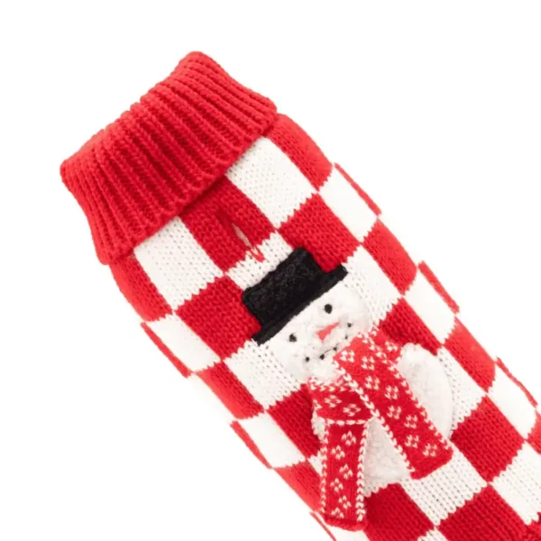 A red and white checkered dog sweater featuring a snowman design on the side.