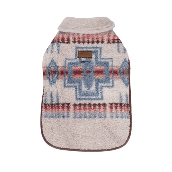 A cozy dog coat featuring a patterned design in shades of blue, red, and cream with a collar and a brown label.