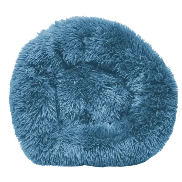 A round, fluffy, blue dog bed.