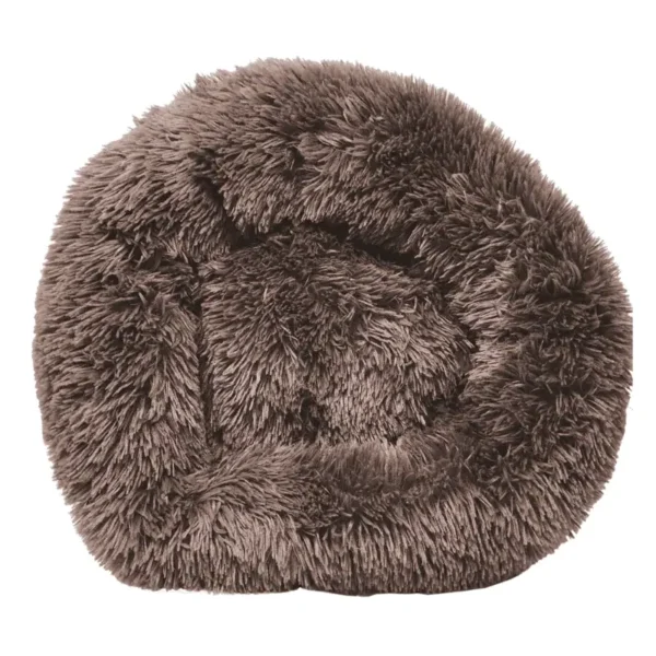 A round, fluffy dog bed in a soft brown color.