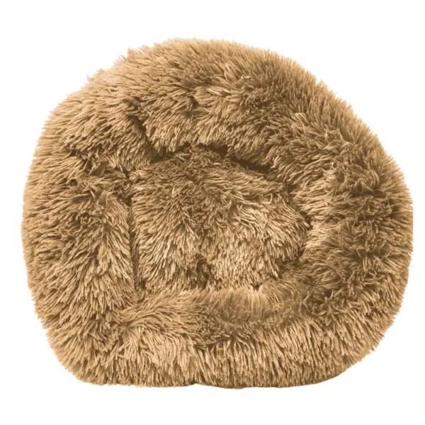 A round, fluffy, tan dog bed.
