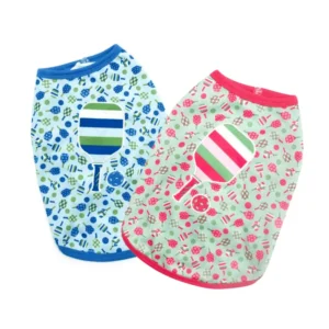 Two colorful dog shirts featuring pickleball designs, one in blue with green, and the other in light green with pink.
