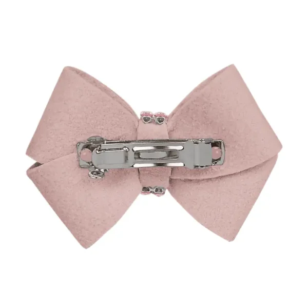 A pink bow with a metal hair clip