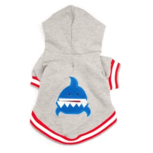 A gray hoodie for dogs featuring a blue shark design on the back, with red and white striped sleeves.