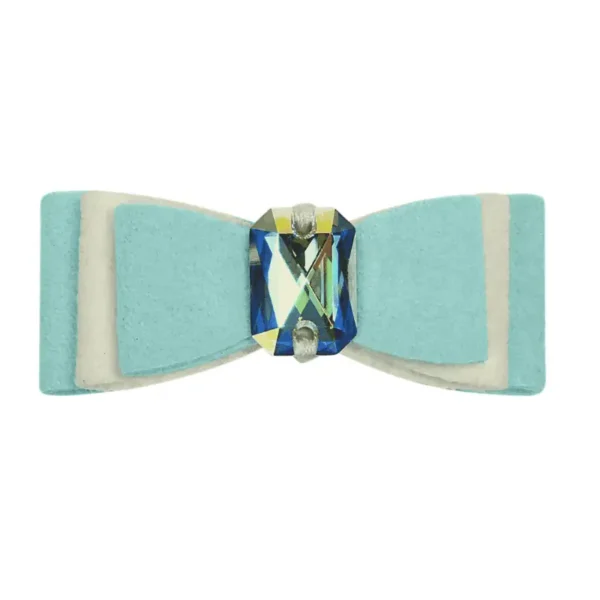 A light blue dog bow hair accessory with a sparkling gem in the center.