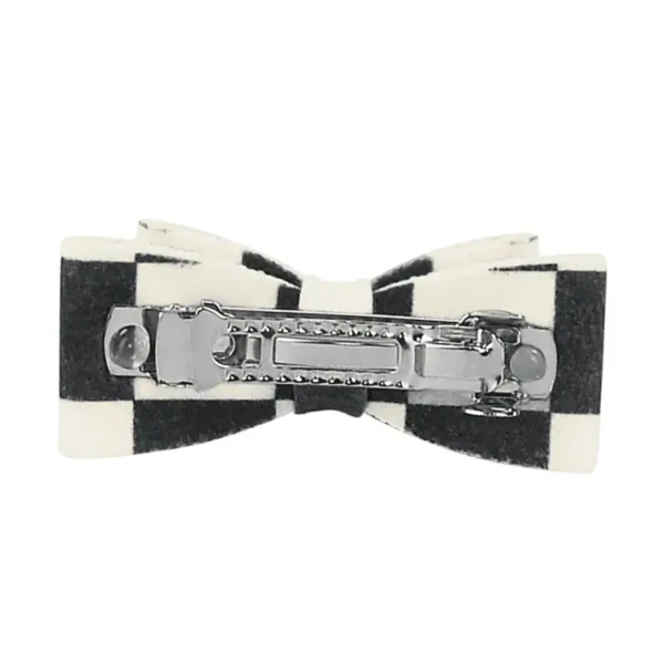 Back of black and white checkered dog hair bow with French metal clip