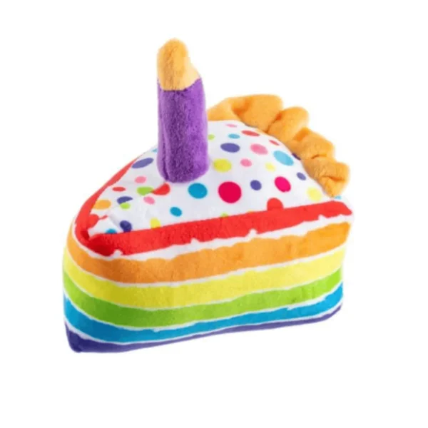 Birthday Cake Slice Dog Toy – top angle view of plush white polka dot cake slice with rainbow icing and purple candle