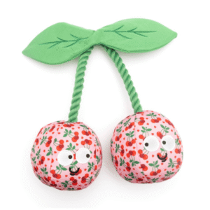 Plush pink cherries dog toy with smiling face and eyes, perfect for dogs who love to tug, toss, and chew.