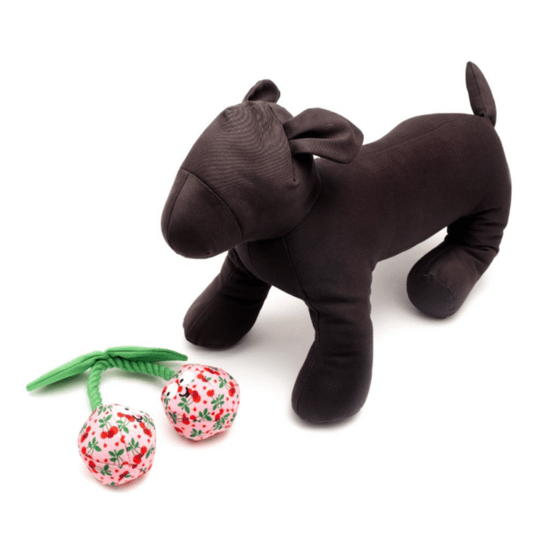 Plush pink cherries dog toy with a dog mannequin