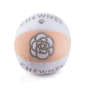 Blush and white plush ball dog toy with gray Chewnel text, paws, and flower