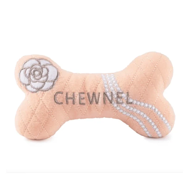 Light pink plush bone dog toy with white pearls, flower, and gray Chewnel text