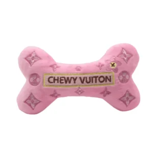 Pink plush bone dog toy with light pink clovers and gold CHEWY VUITON label