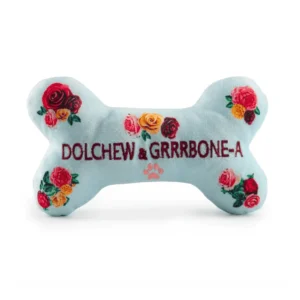 Light blue plush bone dog toy with embroidered roses and dark red Dolchew & Grrrbone-A text