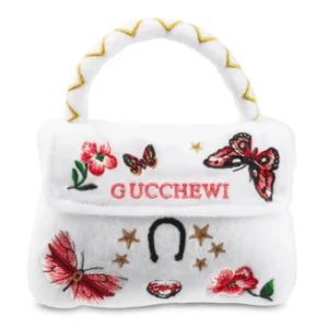 Plush white purse dog toy with red embroidered flowers, butterflies, and gold stars
