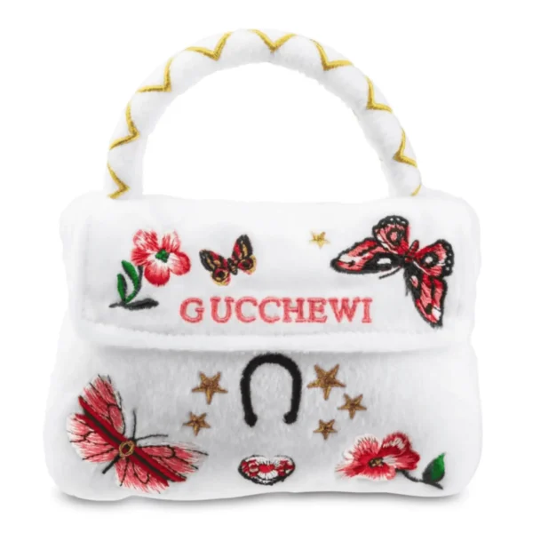 Plush white purse dog toy with red embroidered flowers, butterflies, and gold stars