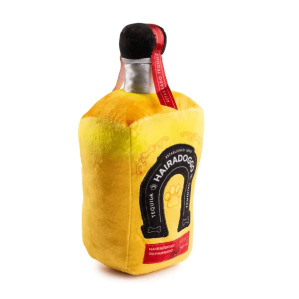 Slanted angle of Plush tequila bottle dog toy with Lucky Dog embroidery, rope details, and back label
