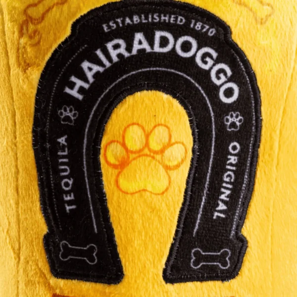 Plush tequila bottle dog toy, close-up of label on plush tequila bottle