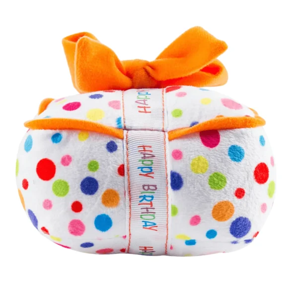 Happy Birthday Gift Box Dog Toy – side view of plush white polka dot gift box with white ribbon featuring rainbow words ‘Happy Birthday’ and orange ribbon