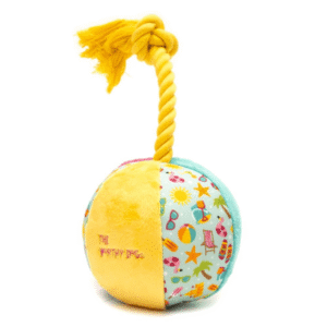 Colorful beach-themed dog toy with rugged fabric, strong lining, and multiple squeakers for tug, toss, and chew play.