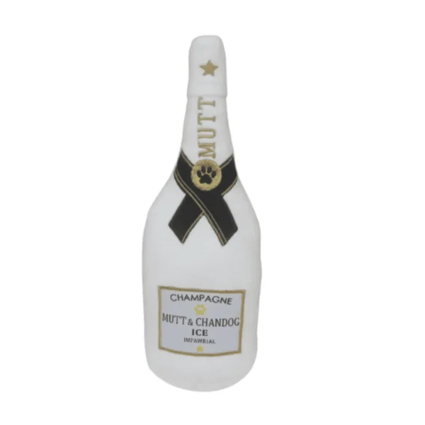 White plush champagne bottle dog toy with gold MUTT text, paw ribbon, and CHAMPAGNE label