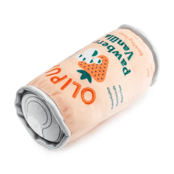 Lying and slanted angle of Pink plush soda can dog toy with strawberry image and Pawberry Vanilla label