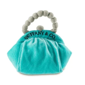 Plush turquoise Sniffany Blue Purse dog toy shaped like a clutch purse with gray pearl handle and black embroidered “SNIFFANY & CO.” wording. Soft squeaky toy perfect for stylish pups.