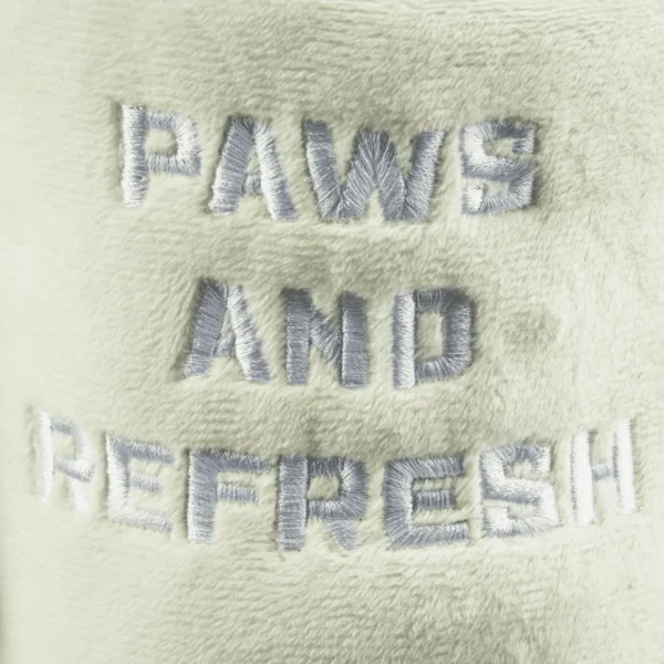 Snuggly Cup – Ivory Dog Toy – close-up of embroidered ‘Paws And Refresh’ on plush ivory cup