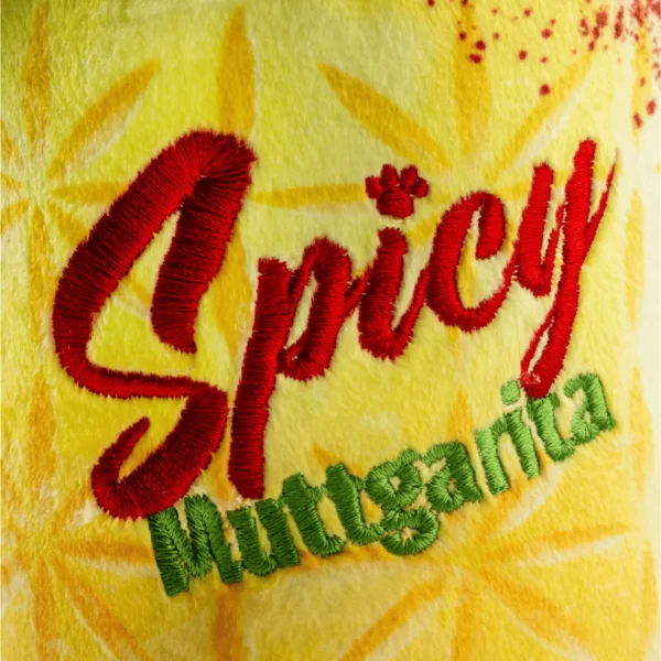 Yellow plush margarita cup dog toy with salt rim and lime wedge accent. Close-up view of label