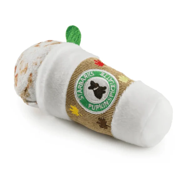 Lying down at an angle of plush latte cup dog toy with faux whipped cream, spice, and green straw.